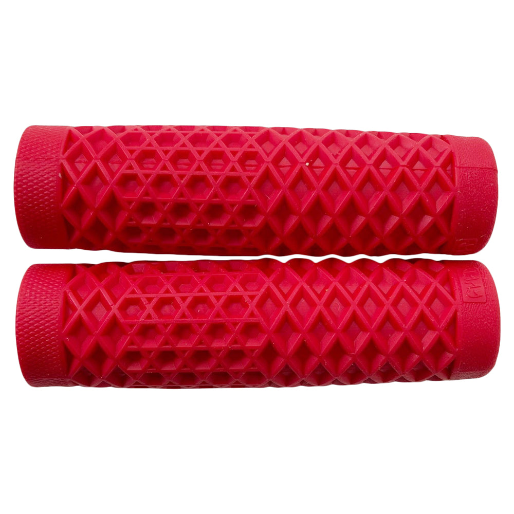 Two red, textured Vans + Cult Motorcycle Grips - 1" Red from ODI, made from ODI proprietary grip compounds, are aligned horizontally against a white background.