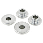 Four round metal TC Bros. Solid Billet Handlebar Riser Bushings isolated on a white background.