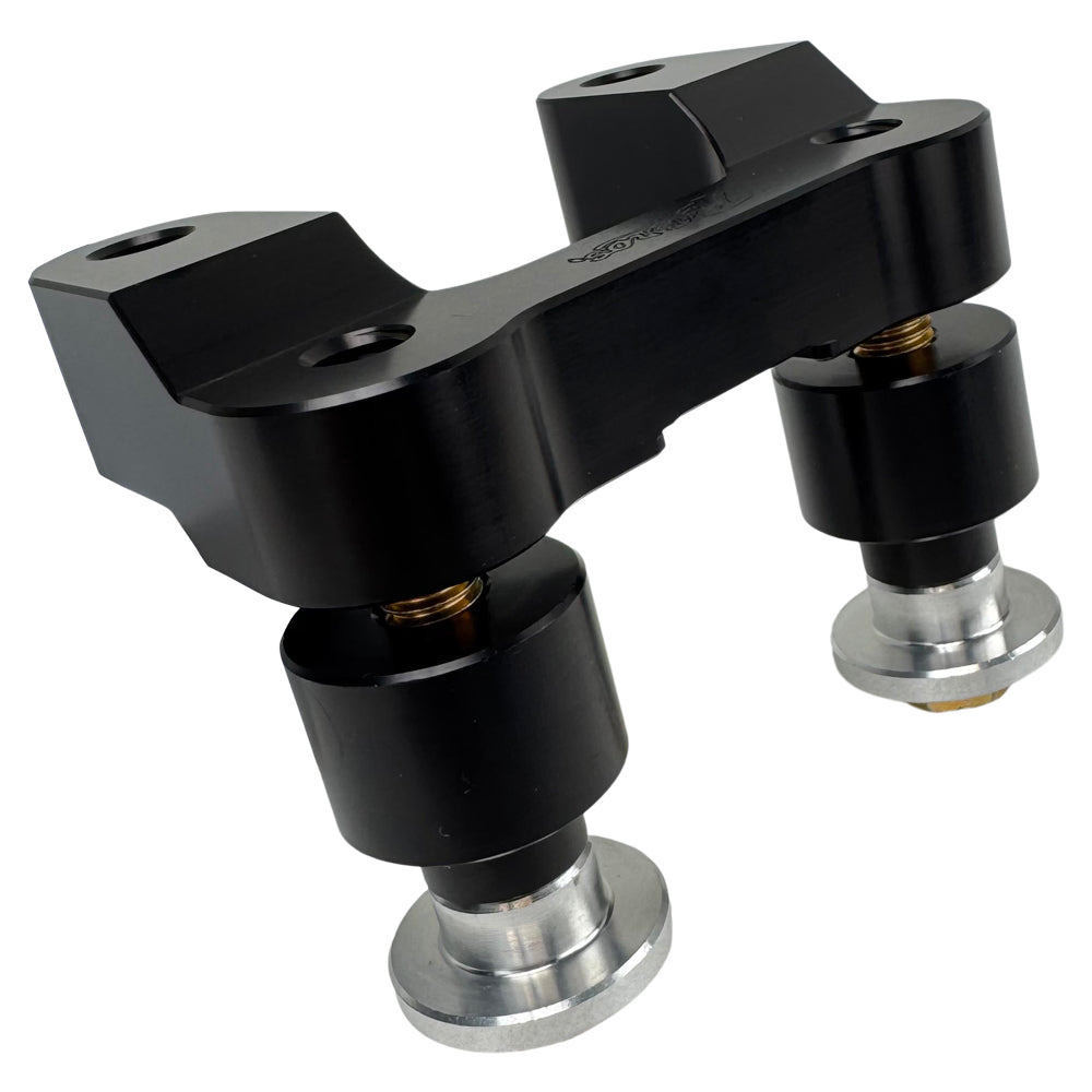 The TC Bros. Pro Series Riser Adapter features black anodized metal, two mounting holes, silver cylindrical ends, and engraved branding—ideal for upgrading 2006-2013 Harley-Davidson Street Glide handlebars.