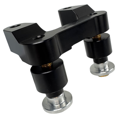 The TC Bros. Pro Series Riser Adapter features black anodized metal, two mounting holes, silver cylindrical ends, and engraved branding—ideal for upgrading 2006-2013 Harley-Davidson Street Glide handlebars.