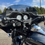TC Bros. Pro Series Handlebar Riser Adapter for 2006-2013 Harley-Davidson Street Glide, with an ignition lock retainer kit and TC Bros. branding, features a machined black finish and two mounting holes.