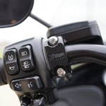 Close-up of TC Bros. Pro Series Clutch and Brake Perch Clamps for 1984-Up Harley-Davidson motorcycles, designed for 1" handlebars, showing control buttons, bolts, and the engraved TC Bros. brand name.