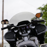 Close-up of TC Bros. Pro Series Clutch and Brake Perch Clamps for 1984-Up Harley-Davidson motorcycles, designed for 1" handlebars, showing control buttons, bolts, and the engraved TC Bros. brand name.