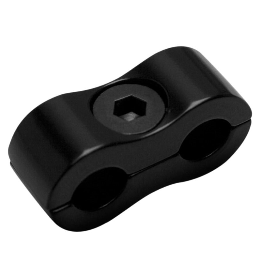 Black dual-hole Motion Pro cable clamp with a hexagonal socket screw on a plain background.