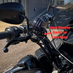The TC Bros. Gauge Relocation Bracket for Pro Series Truss Risers includes one silver and one black metal clamp with knurled screw mechanisms, plus four screws—perfect for mounting your motorcycle gauge.