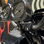 Two TC Bros. Pro Series Gauge Relocation Mount Extensions, one silver and one black, each with a matching screw, display adjustability and American craftsmanship on a white background.