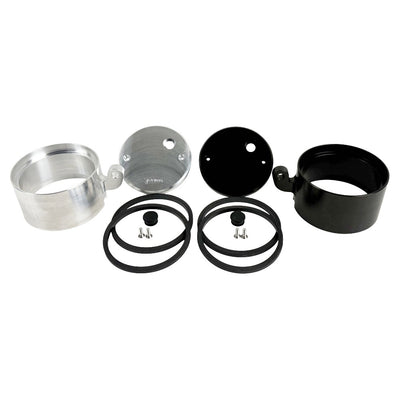 Two cylindrical motorcycle tachometer bezels from TC Bros., including the Pro Series 4 inch Gauge Relocation Bezel for Harley Davidson, in black and silver finishes with similar gauge faces featuring numbers and a red needle.