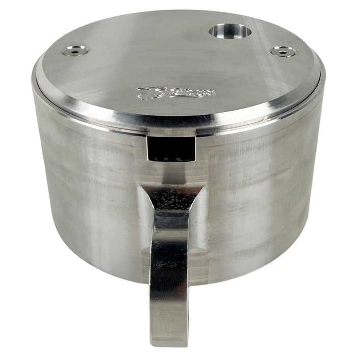Two cylindrical motorcycle tachometer bezels from TC Bros., including the Pro Series 4 inch Gauge Relocation Bezel for Harley Davidson, in black and silver finishes with similar gauge faces featuring numbers and a red needle.
