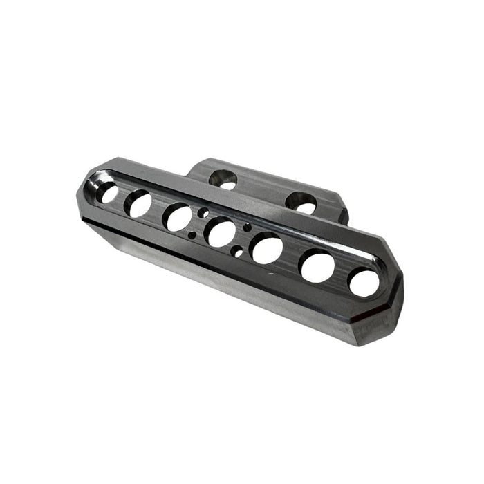 The TC Bros. Pro Series Indicator Light Relocation Kit is a beveled-edge, rectangular metal component with multiple holes, designed to mount indicator lights on select Harley-Davidson risers for custom setups.