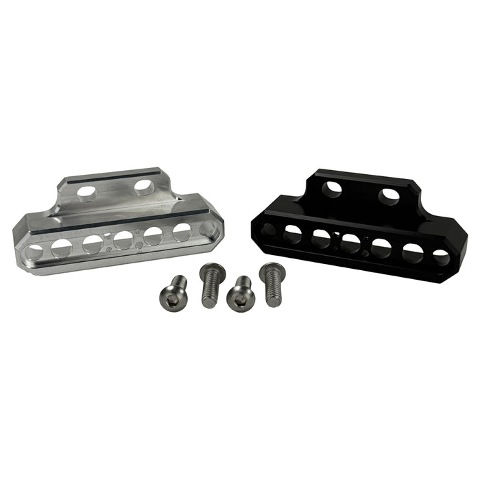 Two cylindrical motorcycle tachometer bezels from TC Bros., including the Pro Series 4 inch Gauge Relocation Bezel for Harley Davidson, in black and silver finishes with similar gauge faces featuring numbers and a red needle.