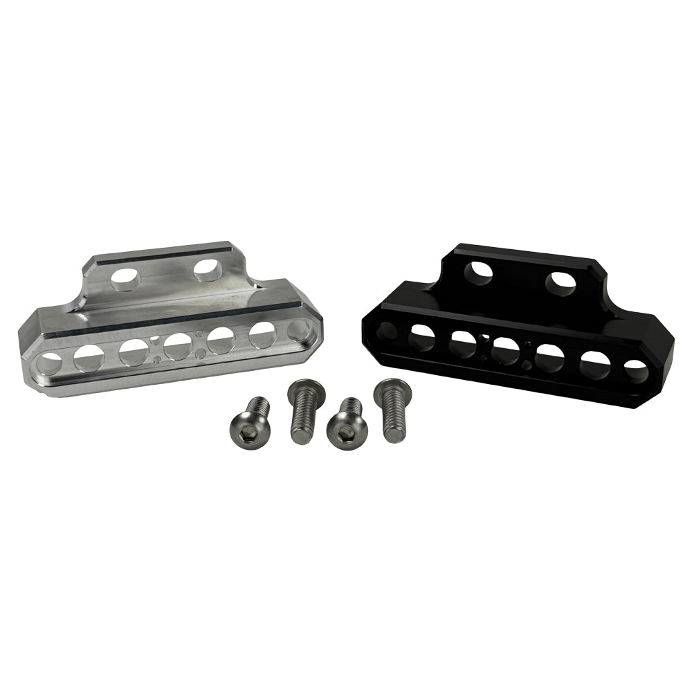 Two cylindrical motorcycle tachometer bezels from TC Bros., including the Pro Series 4 inch Gauge Relocation Bezel for Harley Davidson, in black and silver finishes with similar gauge faces featuring numbers and a red needle.