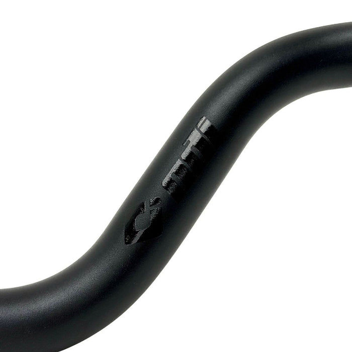 The ODI Podium V-Twin 1-1/8" Moto Handlebar for Harley-Davidson, designed for second generation throttle-by-wire motorcycles, features a black finish with a slight upward and backward sweep, reminiscent of classic moto handlebars.
