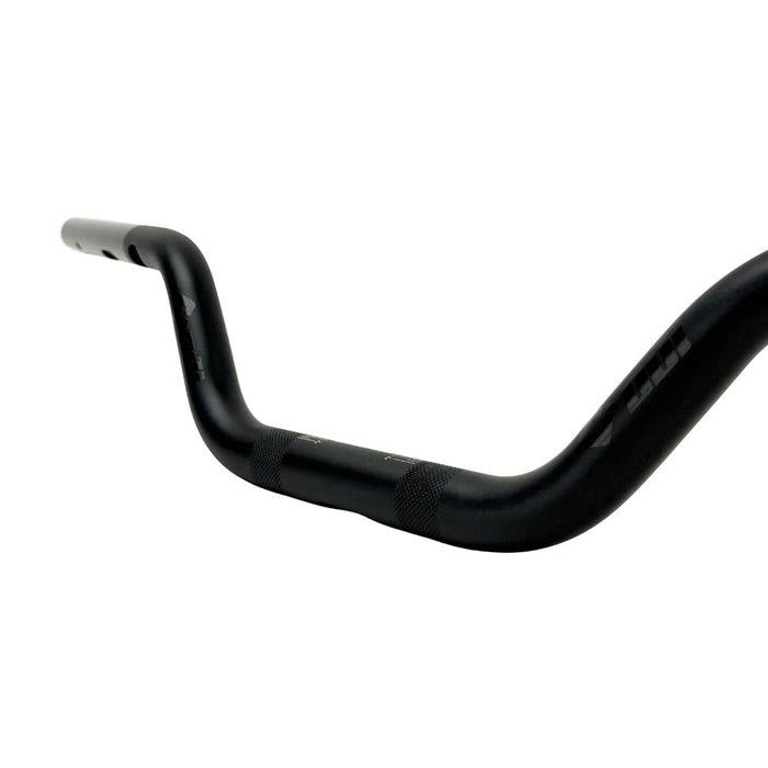 The ODI Podium V-Twin 1-1/8" Moto Handlebar for Harley-Davidson, designed for second generation throttle-by-wire motorcycles, features a black finish with a slight upward and backward sweep, reminiscent of classic moto handlebars.