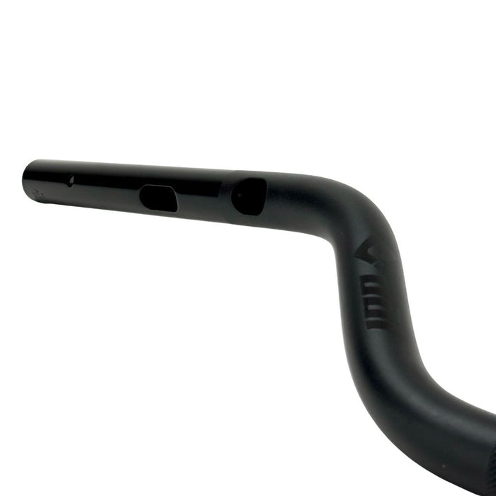The ODI Podium V-Twin 1" Moto Handlebar for Harley-Davidson Second Generation Throttle-By-Wire Motorcycles features a black finish and slight upward/backward sweep, inspired by V-Twin design, shown on a white background.