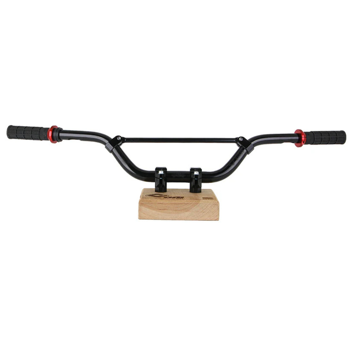 The ODI V-Twin Handlebar Crossbar by ODI includes two metal crossbars (one silver, one black) with three white mounting clips each—perfect as a motocross handlebar accessory. A faint bicycle handlebar image appears below.