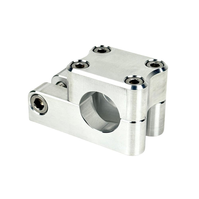 Close-up view of the TC Bros. Pro Series 1" Universal Gauge Mount, a shiny chrome-plated bracket with cylindrical parts by TC Bros., perfect for Harley-Davidson gauge relocation.
