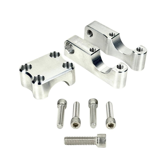 Close-up view of the TC Bros. Pro Series 1" Universal Gauge Mount, a shiny chrome-plated bracket with cylindrical parts by TC Bros., perfect for Harley-Davidson gauge relocation.