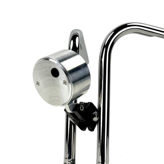 Close-up view of the TC Bros. Pro Series 1" Universal Gauge Mount, a shiny chrome-plated bracket with cylindrical parts by TC Bros., perfect for Harley-Davidson gauge relocation.