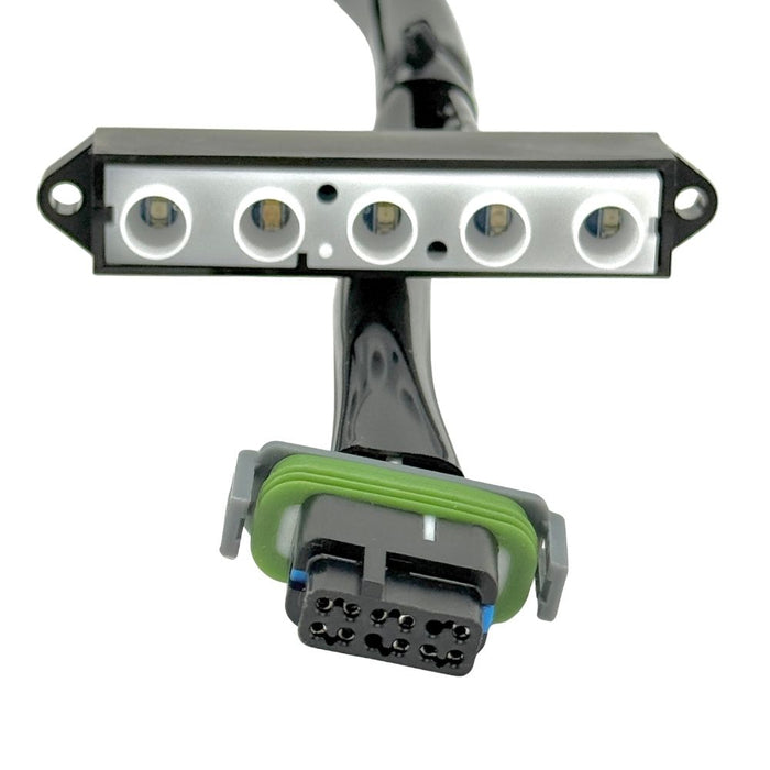 The Guerrilla Cables Speedometer Relocation Harness for 2014-2022 Harley-Davidson Sportster (Single Gauge) is a black electrical cable featuring a rectangular connector on one end and a multi-pin connector on the other, coiled into a loose loop—designed by Guerrilla Cables as a plug-and-play solution for relocating your Sportster’s speedometer.
