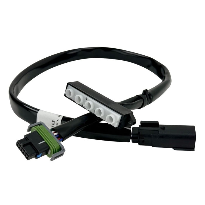 The Guerrilla Cables Speedometer Relocation Harness for 2014-2022 Harley-Davidson Sportster (Single Gauge) is a black electrical cable featuring a rectangular connector on one end and a multi-pin connector on the other, coiled into a loose loop—designed by Guerrilla Cables as a plug-and-play solution for relocating your Sportster’s speedometer.