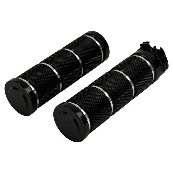 Three Moto Iron® Knurled Billet Grips for Harley-Davidson in silver, black, and gold are shown upright against a white background.