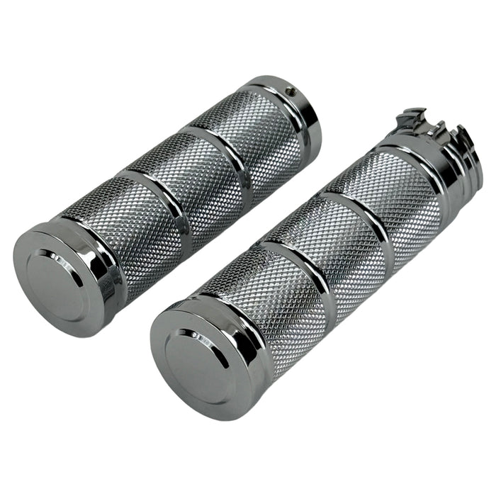 Three Moto Iron® Knurled Billet Grips for Harley-Davidson in silver, black, and gold are shown upright against a white background.