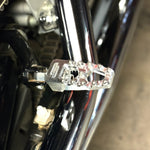 Four TC Bros. Pro Series MX Lite Footpegs for 1977-2022 Harley-Davidson in silver, black, and gold are arranged vertically on a white background.