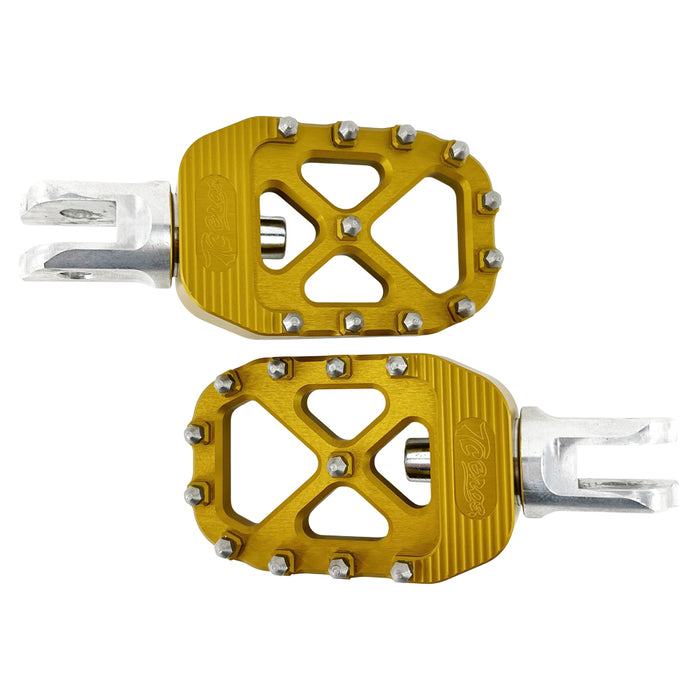 The TC Bros. Pro Series MX Foot Pegs for Harley Davidson come in silver, black, and gold with a rugged, spiked design and diagonal layout for superior grip.