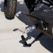 Three TC Bros. Pro Series MX Lite Foot Pegs for Harley Davidson models, featuring metallic spiked surfaces, are arranged side by side in silver, black, and gold.