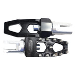 Three TC Bros. Pro Series MX Lite Foot Pegs for Harley Davidson models, featuring metallic spiked surfaces, are arranged side by side in silver, black, and gold.