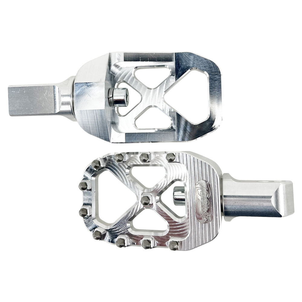 Two silver aluminum bicycle pedals with multiple grip studs, designed for increased traction and control—perfectly inspired by the rugged durability of TC Bros. Pro Series MX Passenger Foot Pegs for 2018-newer Harley Softail & Pan America from TC Bros.