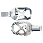The TC Bros. Pro Series MX Foot Pegs for Harley Davidson come in silver, black, and gold with a rugged, spiked design and diagonal layout for superior grip.