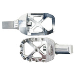 The TC Bros. Pro Series MX Foot Pegs for Harley Davidson come in silver, black, and gold with a rugged, spiked design and diagonal layout for superior grip.