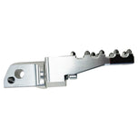 Three TC Bros. Pro Series MX Lite Foot Pegs for Harley Davidson models, featuring metallic spiked surfaces, are arranged side by side in silver, black, and gold.