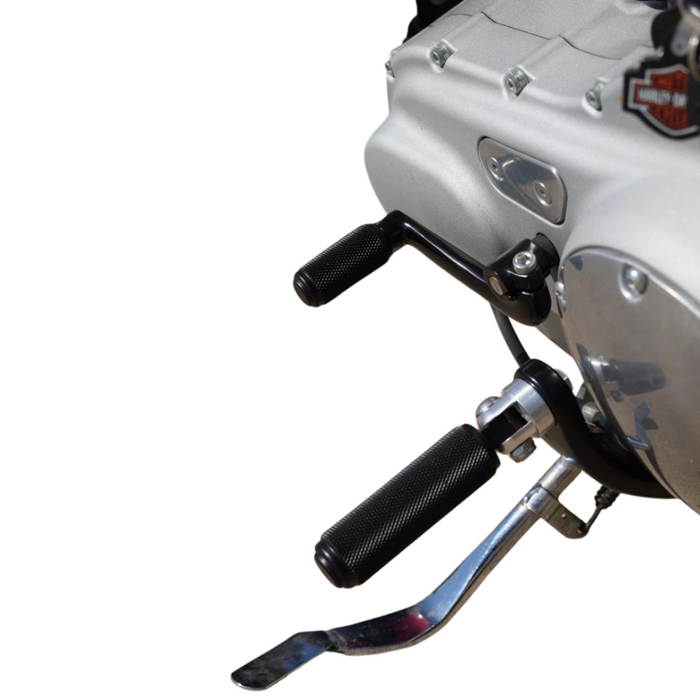 The TC Bros. Nomad Shift/Brake Peg for Harley-Davidson features CNC-machined aluminum pegs in silver, gold, and black with textured grips and threaded bolts. Ideal as a shift or brake peg. "NOMAD SHIFT/TOE PEG" text appears at the top.