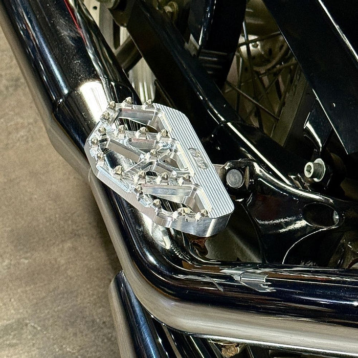 Three TC Bros. Pro Series MX Mini Floorboards for 1977-2022 Harley-Davidson in silver, black, and gold are shown on a white background, each featuring flat metal platforms with grip pins for adjustable foot peg mounting.