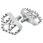 Three TC Bros. Pro Series MX Mini Floorboards for Harley-Davidson, in silver, black, and gold, are diagonally arranged on a white background.