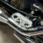 Three TC Bros. Pro Series MX Mini Floorboards for 1977-2022 Harley-Davidson in silver, black, and gold are shown on a white background, each featuring flat metal platforms with grip pins for adjustable foot peg mounting.