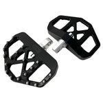 Three TC Bros. Pro Series MX Mini Floorboards for Harley-Davidson, in silver, black, and gold, are diagonally arranged on a white background.