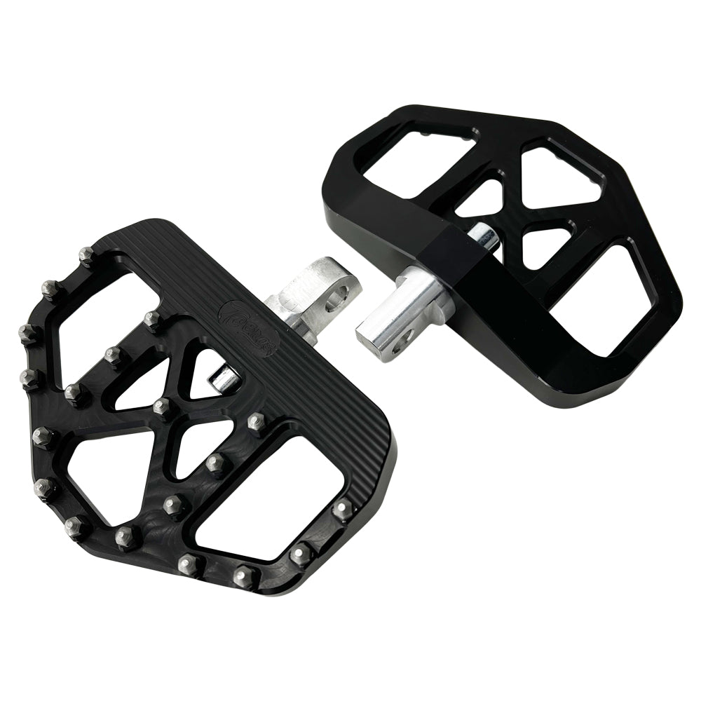 A pair of TC Bros. Pro Series Black MX Mini Floorboards for Harley Davidson Models with silver spikes.
