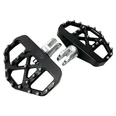 A pair of black, metal TC Bros. Pro Series Black MX Rider Mini Floorboards for 2018-newer Harley Softail & Pan America with grip studs, isolated on a white background.