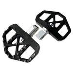 Three TC Bros. Pro Series MX Mini Floorboards for Harley-Davidson, in silver, black, and gold, are diagonally arranged on a white background.