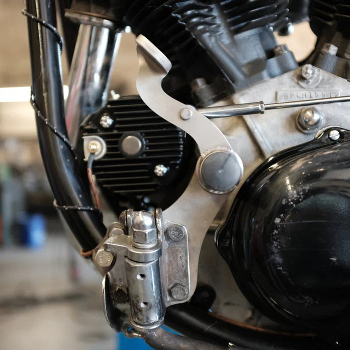 A Prism Supply Sling Shot Clutch Control - 4 Speed - Mild Steel with screws and bolts on a white background, resembling a Harley-Davidson Big Twin accessory.