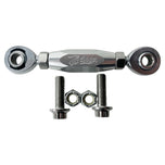 The TC Bros. FXR & M8 Softail Adjustable Shifter Linkage for Mid Controls showcases three adjustable turnbuckle rod ends in black, gold, and silver, arranged vertically. Crafted from CNC machined aluminum, these precision parts are ideal for Harley Davidson shifter linkage applications. Two bolts and two nuts are neatly placed below the rod ends, completing the arrangement.