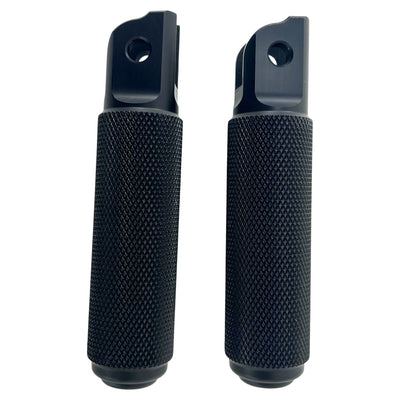 Two black TC Bros. Nomad Rider Foot Pegs fits 2018-up Harley Softail M8 & Pan America - Black with textured grips and mounting brackets, shown side by side against a white background.