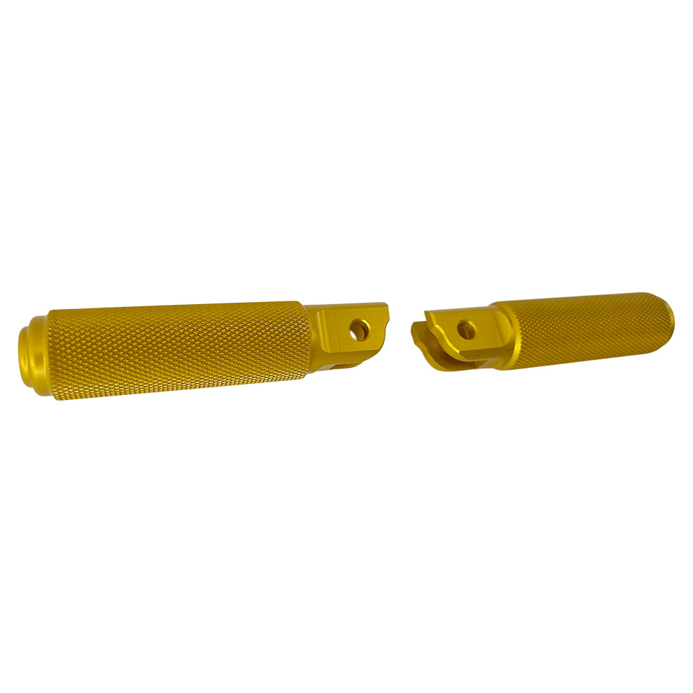 Two yellow metal TC Bros. Nomad Rider Foot Pegs fits 2018-up Harley Softail M8 & Pan America - Gold with textured grips, featuring attachment holes on one end of each peg.