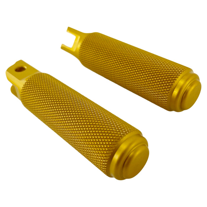 Two yellow metal TC Bros. Nomad Rider Foot Pegs fits 2018-up Harley Softail M8 & Pan America - Gold with textured grips, featuring attachment holes on one end of each peg.