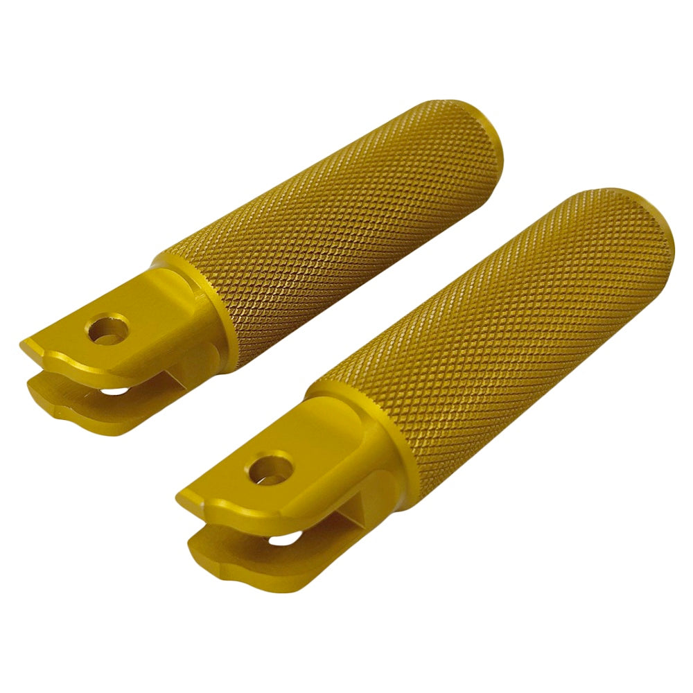 Two yellow metal TC Bros. Nomad Rider Foot Pegs fits 2018-up Harley Softail M8 & Pan America - Gold, crafted from 6061-T6 aluminum, one complete and one partially shown, with textured grips and mounting holes. Ideal for Harley Softail models.