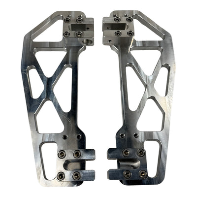 TC Bros. Pro Series MX Slim Floorboards for Harley Davidson Bagger Touring Models feature a skeletal design with metal pins, resembling high-performance pedals in silver, black, and gold. Arranged diagonally, they offer a striking visual appeal.