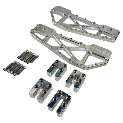 TC Bros. Pro Series MX Slim Floorboards for Harley Davidson Bagger Touring Models feature a skeletal design with metal pins, resembling high-performance pedals in silver, black, and gold. Arranged diagonally, they offer a striking visual appeal.